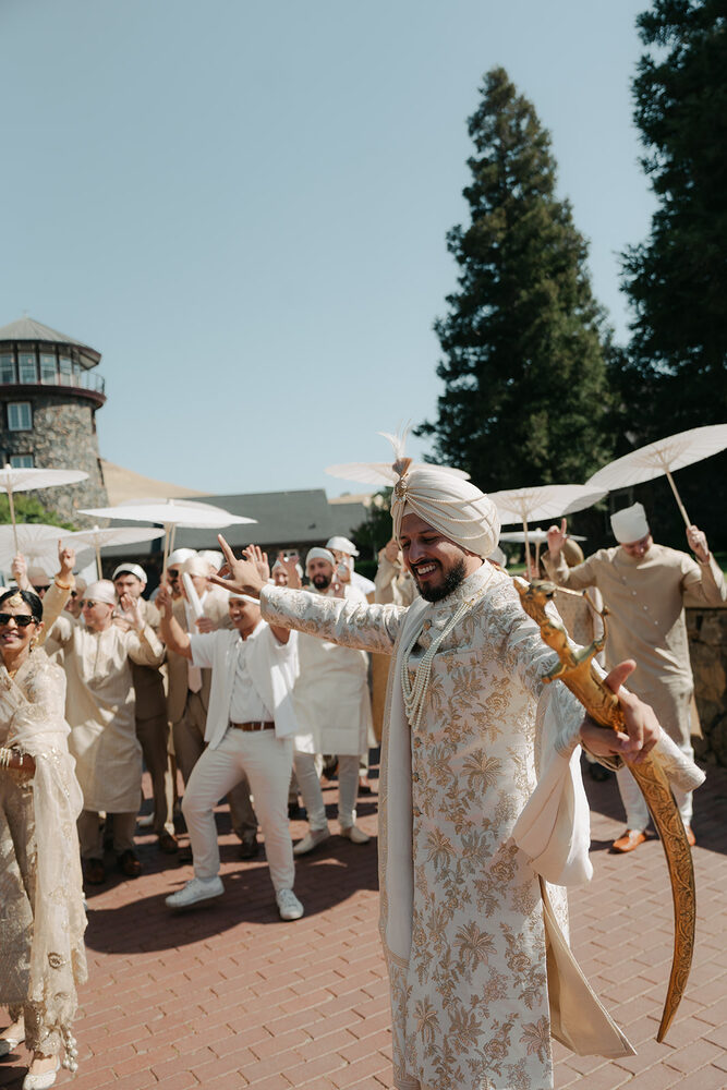 A joyful baraat procession arriving at the Castle