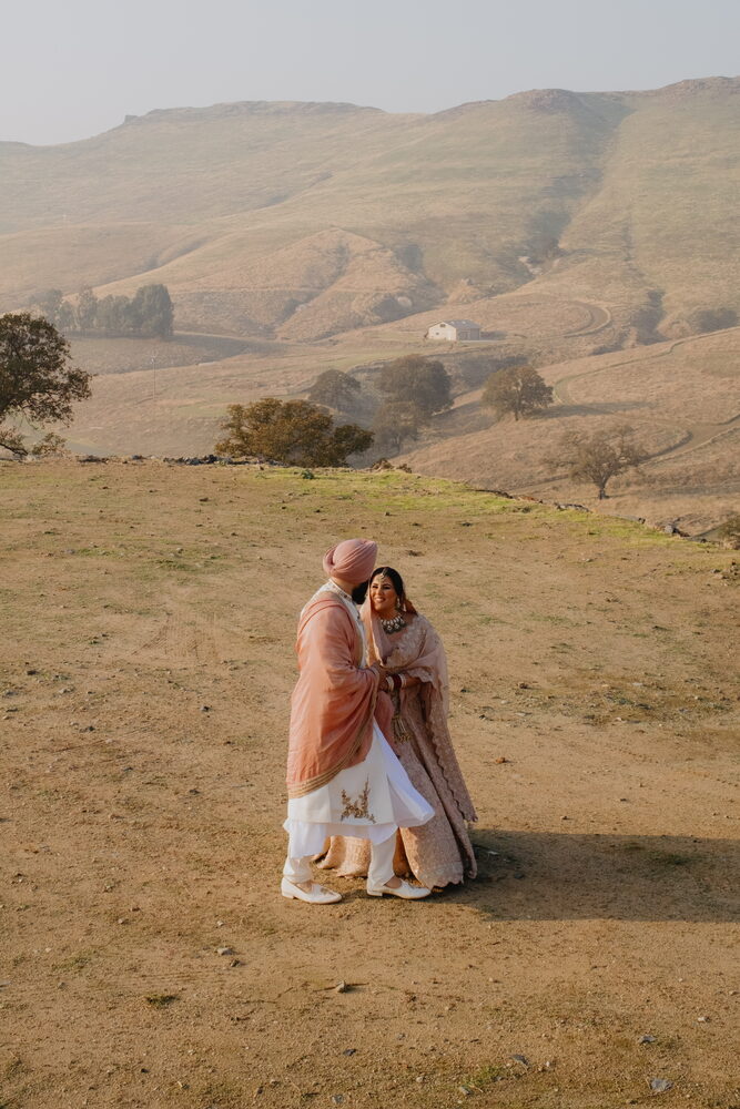 A couple embracing on the golden foothills
