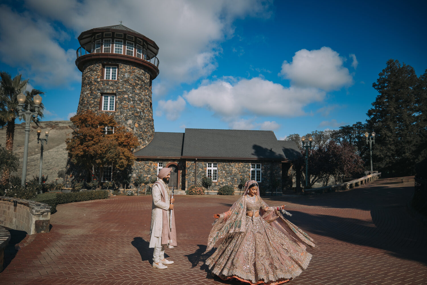 A couple before the estate's granite lighthouse tower