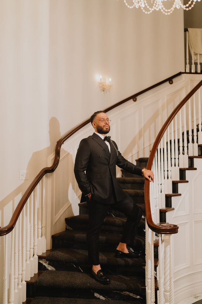 A groom on the Castle's grand staircase