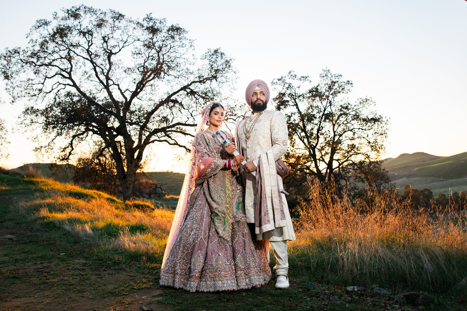 A couple beneath a valley oak at golden hour