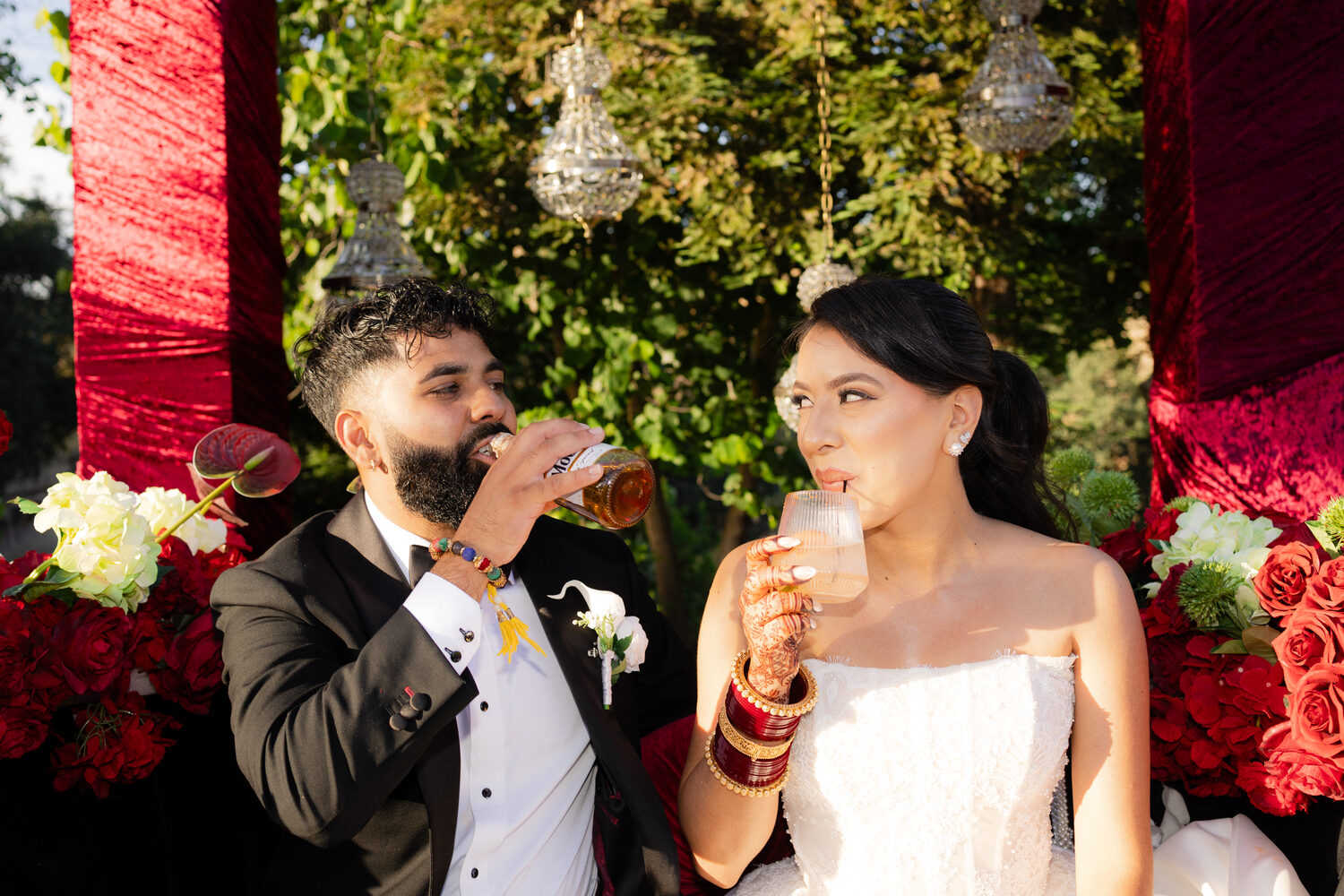 A couple toasting together at their reception