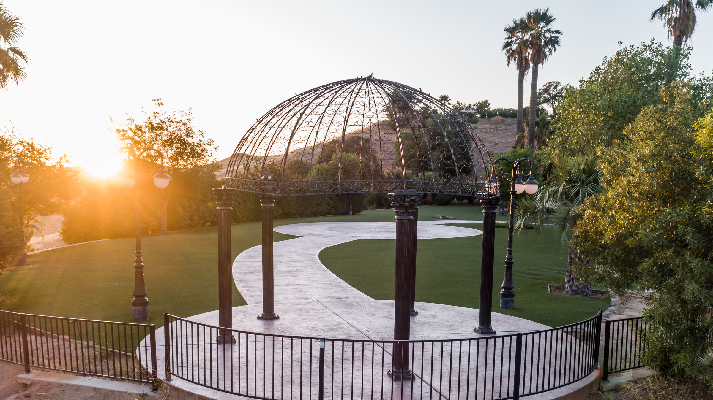 The Rotunda — an iron-domed pavilion glowing at sunset